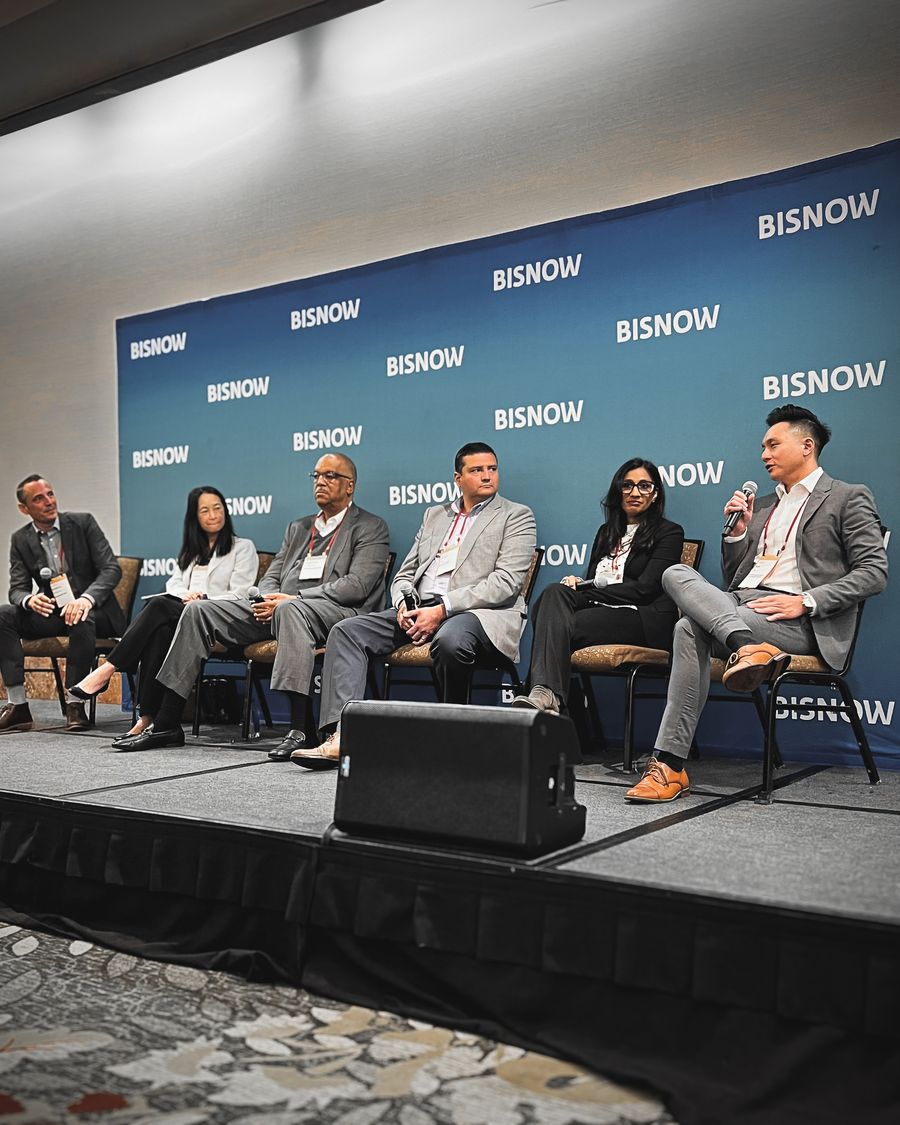 Ben Lee speaking on stage at a Bisnow Los Angeles event on multifamily and affordable housing